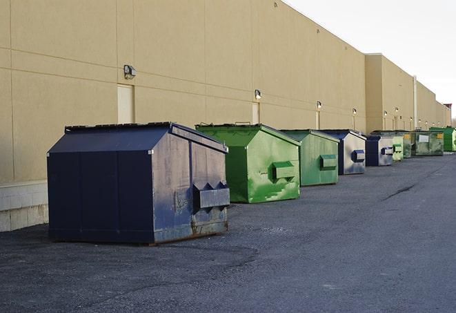 metal waste containers sit at a busy construction site in Essex, CT